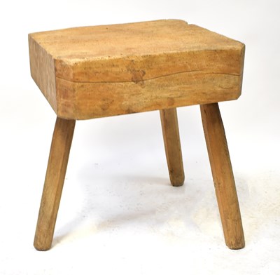 Lot 54 - A pine butcher's block with a solid top to...