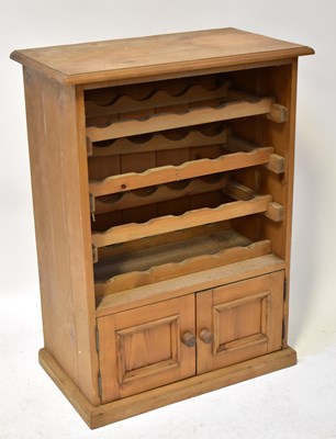 Lot 49 - A pine kitchen wall-hanging unit with four...