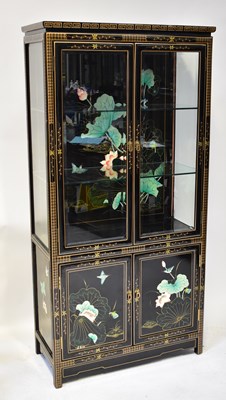 Lot 17 - A modern Oriental-style black lacquered...