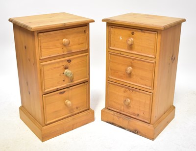 Lot 58 - A pair of pine bedside drawers, with three...