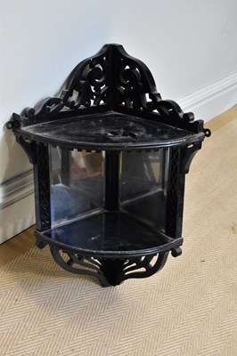 Lot 105 - A Victorian ebonised corner shelf with...