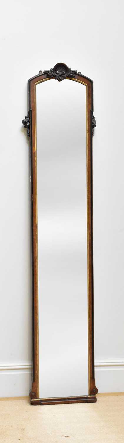 Lot 200 - A Victorian carved walnut freestanding mirror,...