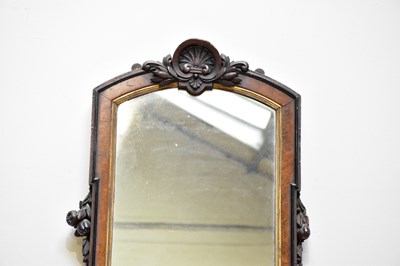 Lot 200 - A Victorian carved walnut freestanding mirror,...