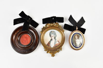 Lot 648 - Two portrait miniatures, both of seated...