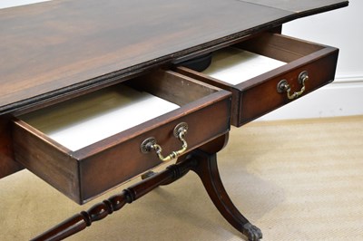 Lot 270 - A reproduction mahogany sofa table, on lyre...