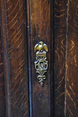 Lot 13 - A George III oak corner cupboard, with two...