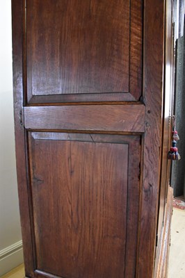 Lot 5 - A George III oak livery cupboard, with two...