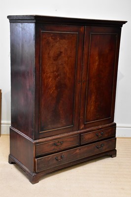 Lot 55 - A George III mahogany linen press, with two...