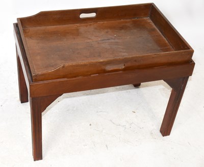 Lot 1603 - A mahogany butler's tray on associated stand...