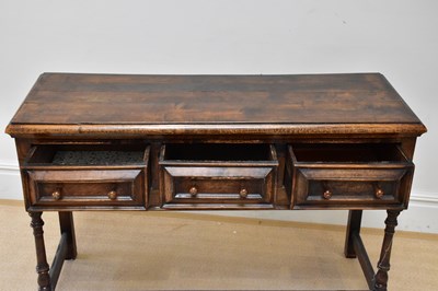Lot 12 - An 18th century style oak dresser base with...