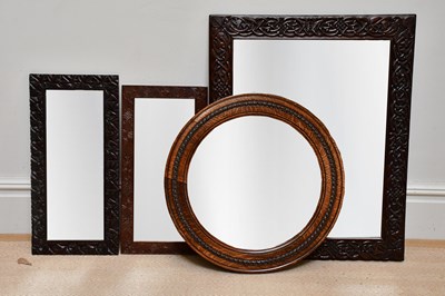 Lot 169 - A Macclesfield carved oak framed wall mirror...