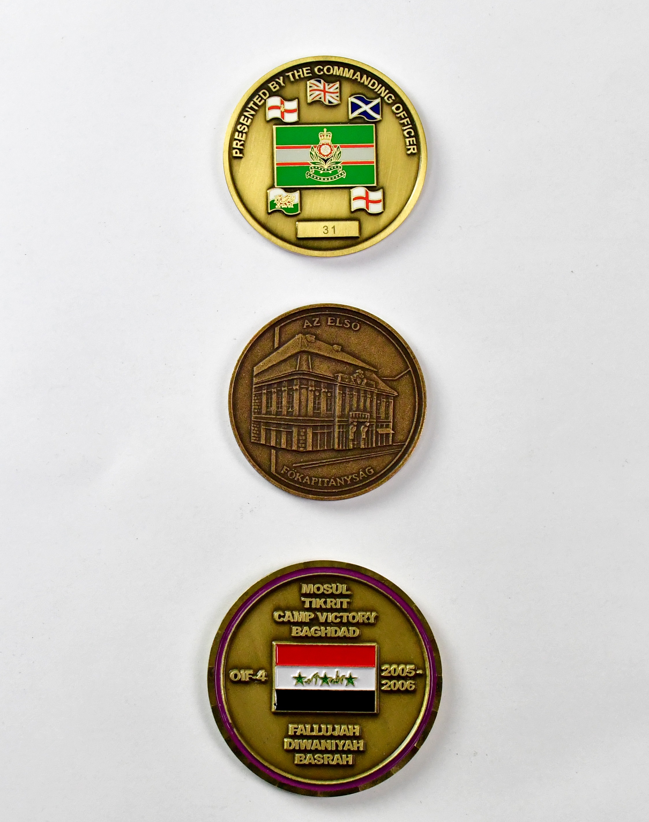 Lot 581 Three military themed commemorative tokens,