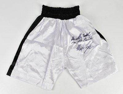Lot 2717 - MIKE TYSON; a pair of signed white and black...