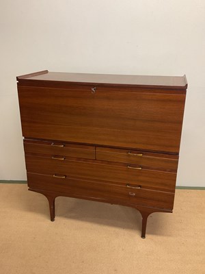 Lot 811 - A mid 20th century drop front bureau desk over...