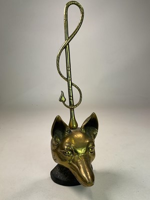 Lot 117 - A brass and iron early 20th century doorstop...