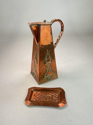 Lot 118 - An Arts and Crafts copper water jug with...