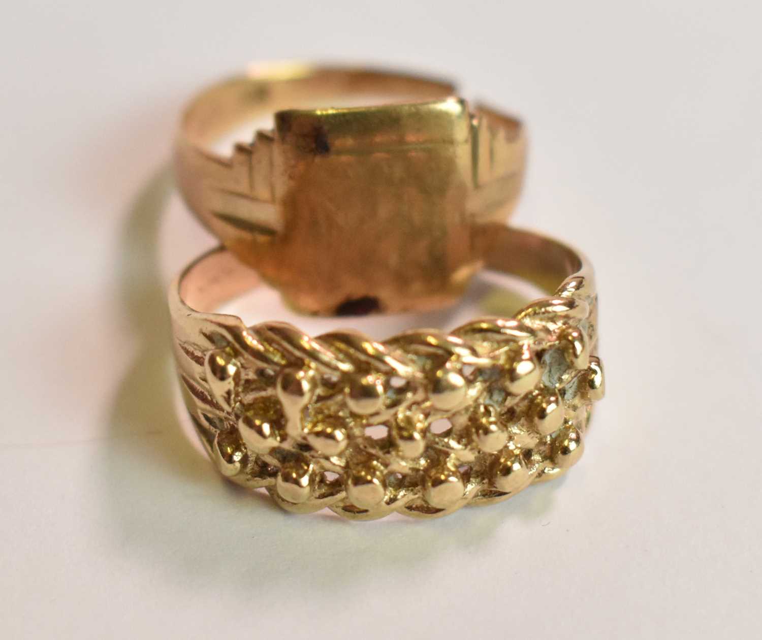 Lot 418 - A 9ct yellow gold broad textured ring, size