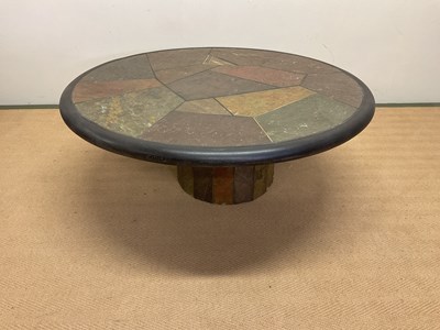 Lot 707 - PAUL KINGMA; a circular polished stone table...