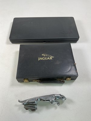 Lot 111 - A Jaguar car mascot with a Jaguar cased tool...