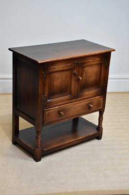 Lot 244 - A reproduction oak side cabinet, with two...