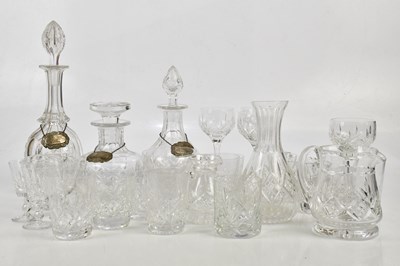 Lot 1587 - Three cut glass decanters, each with...