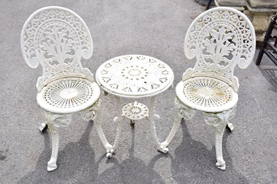 Lot 464 - A pair of white painted cast iron chairs and a...