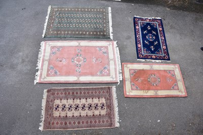 Lot 455 - Five decorative modern rugs including a green...