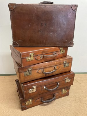 Lot 92 - Five 20th century leather suitcases, largest...