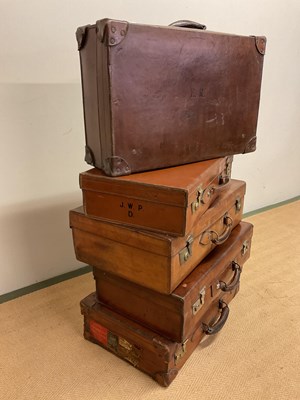 Lot 92 - Five 20th century leather suitcases, largest...