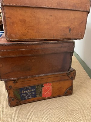 Lot 92 - Five 20th century leather suitcases, largest...