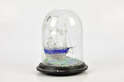 Lot 555 - A Victorian glass frigget in a dome, height 23cm.