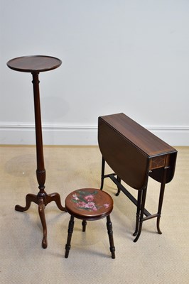 Lot 136 - An Edwardian inlaid mahogany Sutherland table,...