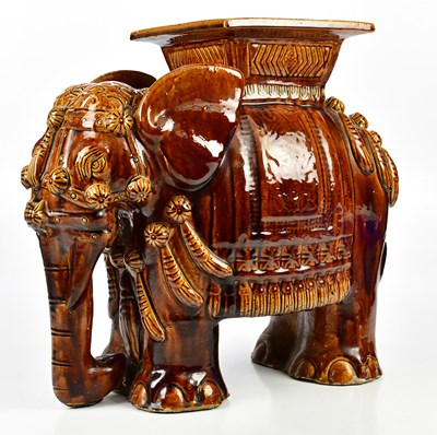 Lot 1389 - A treacle glazed elephant garden seat, height...