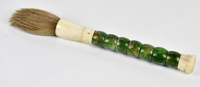 Lot 1317 - A green stone and bone fly whisk, 39cm.