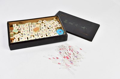 Lot 1228 - A bone and bamboo Mahjong set, cased, together...