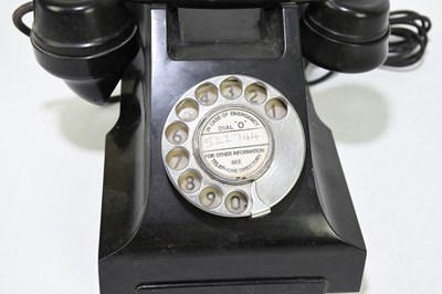 Lot 40 - A vintage bakelite telephone.