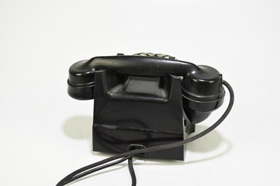 Lot 40 - A vintage bakelite telephone.