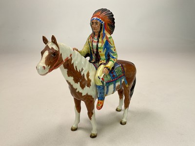 Lot 259 - BESWICK; a mounted Native American on skewbald...