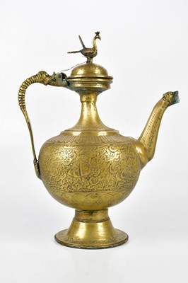 Lot 1315 - A large Persian bronze ewer, height 48cm.