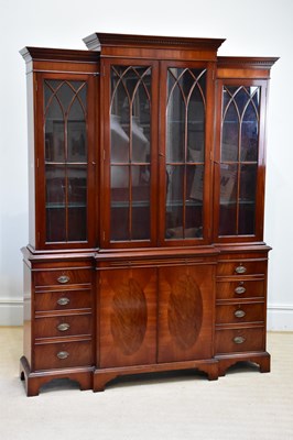 Lot 234 - A reproduction mahogany breakfront bookcase...