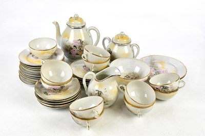 Lot 1497 - A Japanese eggshell porcelain part tea service.