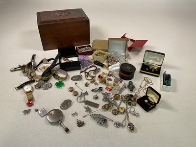 Lot 487 - A collection of costume jewellery in a wooden...