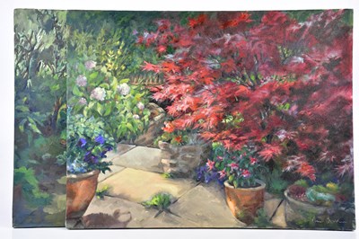 Lot 395 - JUNE BEVAN; two oils on canvas, both of garden...