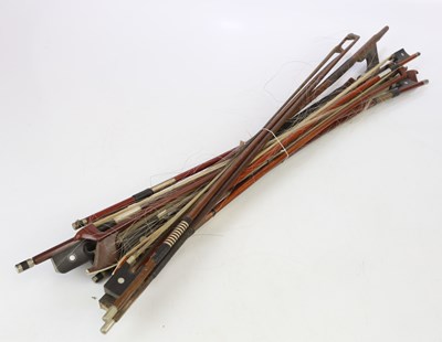 Lot 1055 - Twelve assorted violin and cello bows.