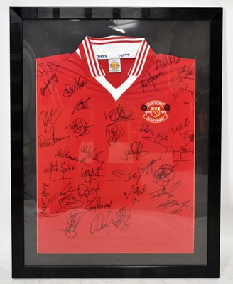 Lot 303 - MANCHESTER UNITED; a framed autographed...