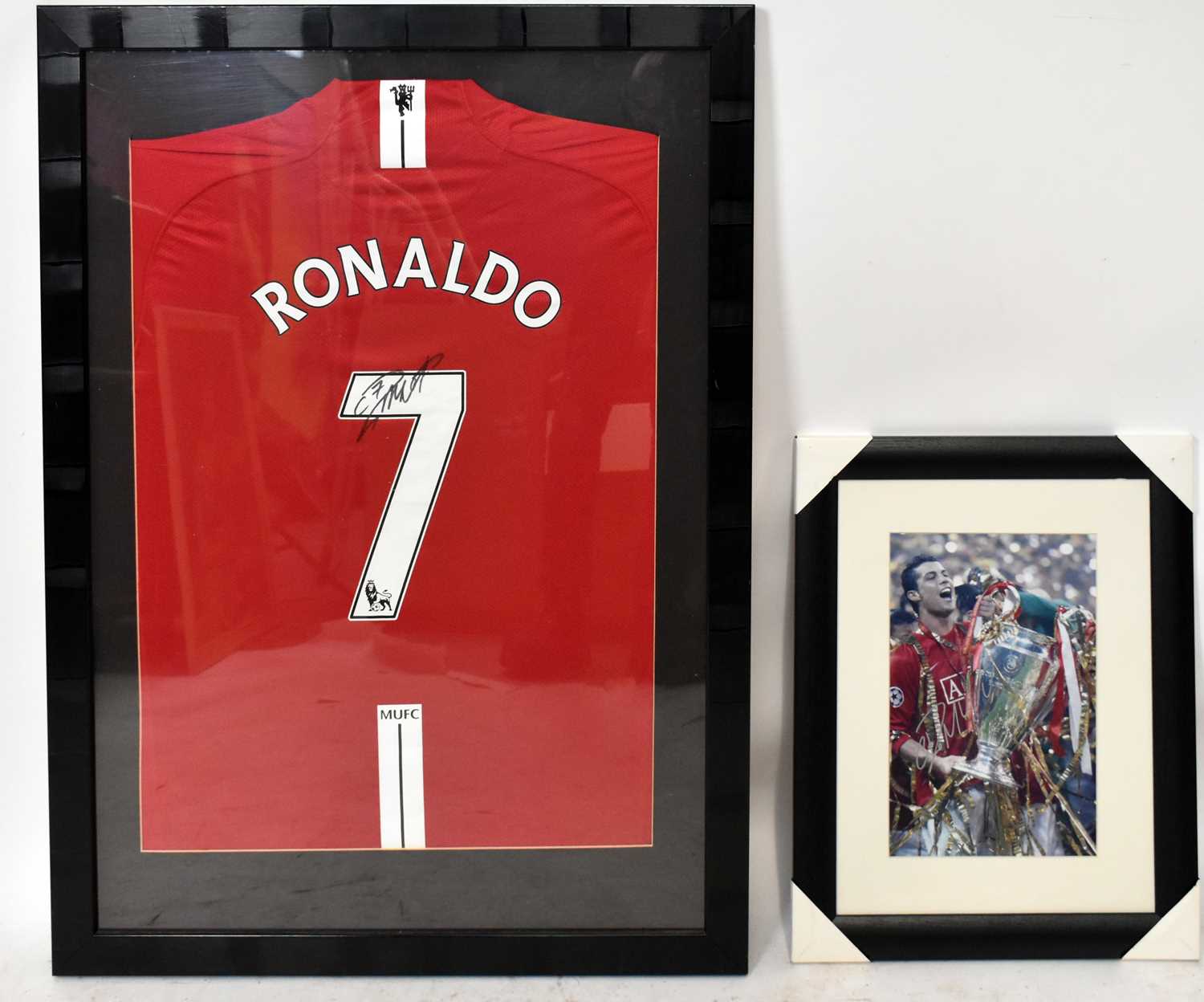 Lot 338 - CRISTIANO RONALDO; a framed autographed...