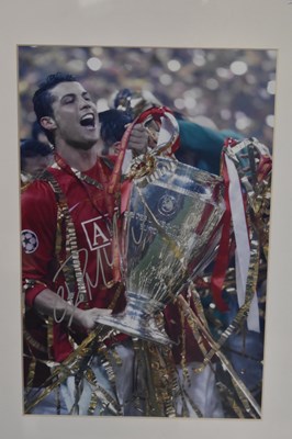 Lot 338 - CRISTIANO RONALDO; a framed autographed...