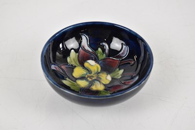 Lot 853 - MOORCROFT; four pieces comprising a footed...