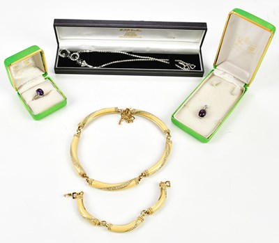 Lot 881 - CHRISTIAN DIOR; a yellow metal and cream...