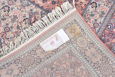 Lot 440 - A Super Keshan rug with floral decoration on a...